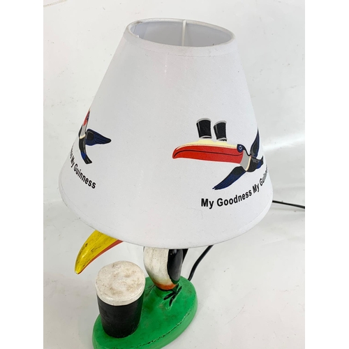 219 - A Toucan Guinness lamp. 41cm