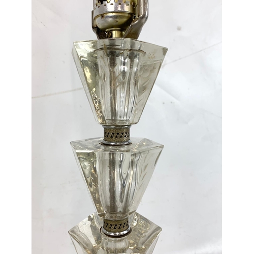 221 - A pair of ornate cut glass lamps. 80cm