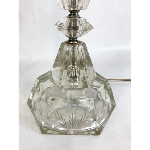 221 - A pair of ornate cut glass lamps. 80cm