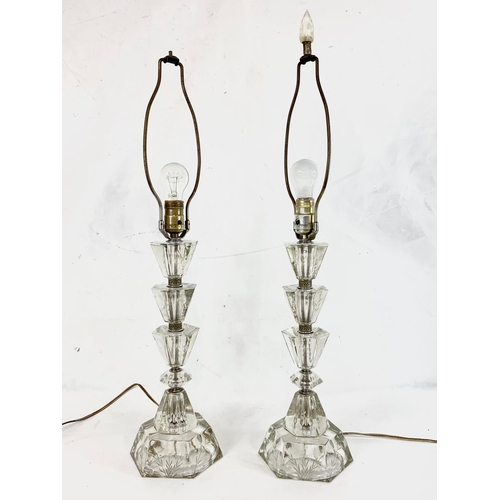 221 - A pair of ornate cut glass lamps. 80cm