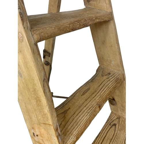 249 - A large set of Edwardian ladders, Simplex Ladder. 188cm