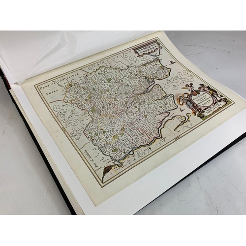 251 - An album of reproduction prints of old maps.