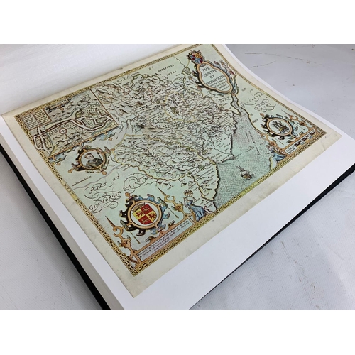 251 - An album of reproduction prints of old maps.