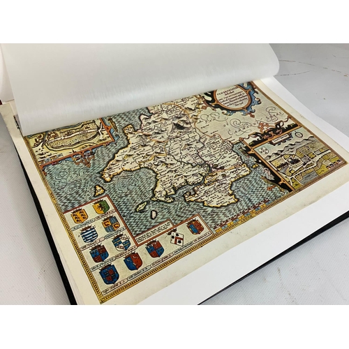 251 - An album of reproduction prints of old maps.