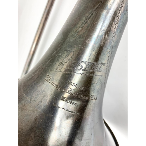 255 - A vintage trombone made by Boosey & Hawlkes Ltd. London.