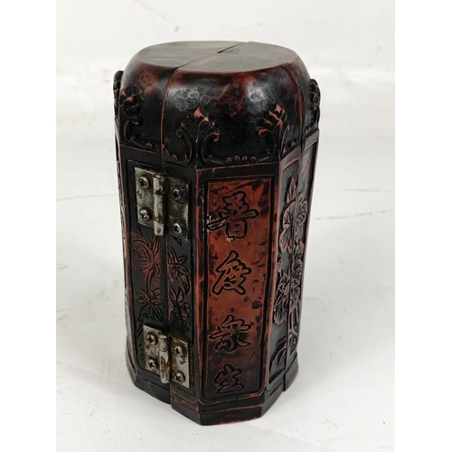 259 - An Oriental style fold up Triptyth.  16.5cm