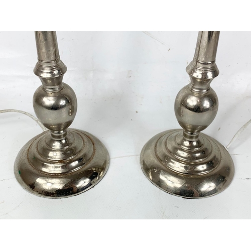 262 - A large pair of alloy lamps.  54cm.