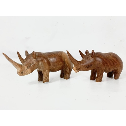 27 - A quantity of carved wooden animals, 36cm