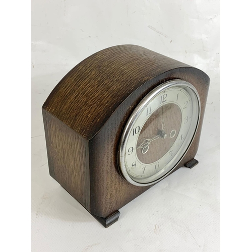 274 - An oak mantle clock.