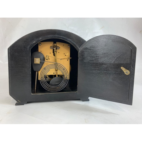 274 - An oak mantle clock.