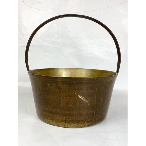 30 - A Large 19th century brass jam pot, 36cm x 38cm including handle