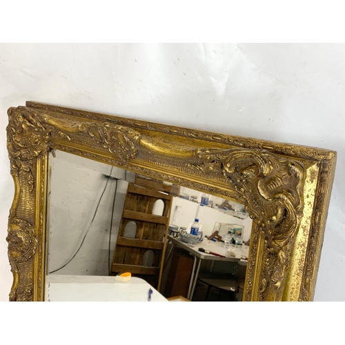 329 - A large heavy gilt frame mirror, 80cm x 70cm