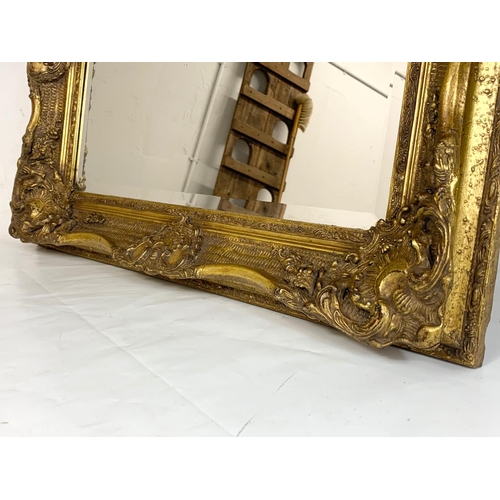 329 - A large heavy gilt frame mirror, 80cm x 70cm