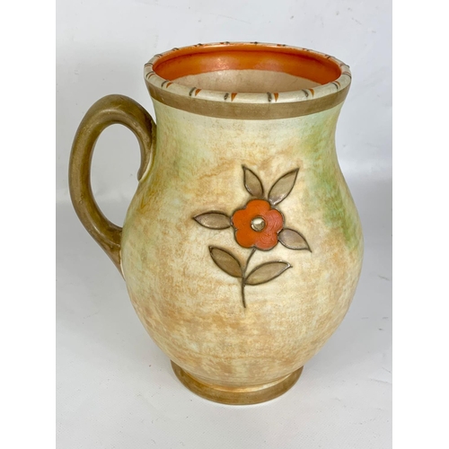 393 - A Charlotte Rhead pot with handle for Crown Ducal.  Pattern number 146.  22 x 20 cm