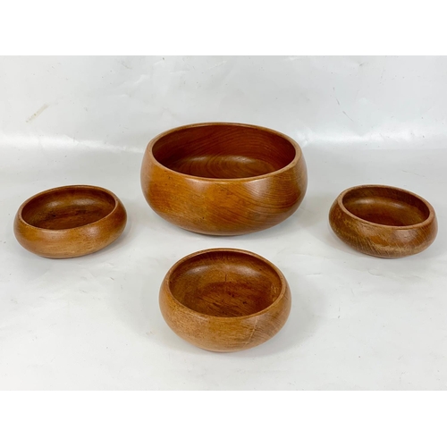 40 - A set of 4 1960s teak bowls, 25cm x 10cm