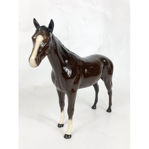 429 - A Royal Doulton porcelain horse figure, 25cm x 20cm