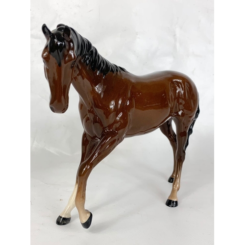 431 - A Royal Doulton porcelain horse figure, 24cm x 18.5cm