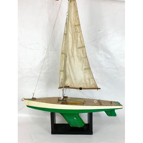 44 - A vintage pond yacht on stand, circa 1950. 66cm x 112cn