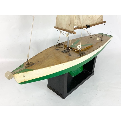 44 - A vintage pond yacht on stand, circa 1950. 66cm x 112cn