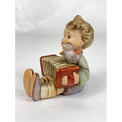 443 - An M.J. Hummel Goebel pottery figure, 