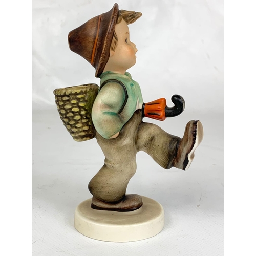 447 - An M.J. Hummel Goebel pottery figure, 