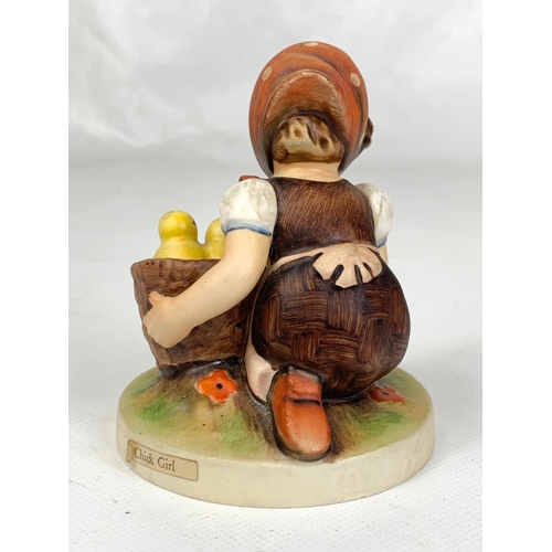 452 - An M.J. Hummel Goebel pottery figure, 