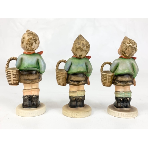 459 - Three M.J. Hummel Goebel pottery figures, 