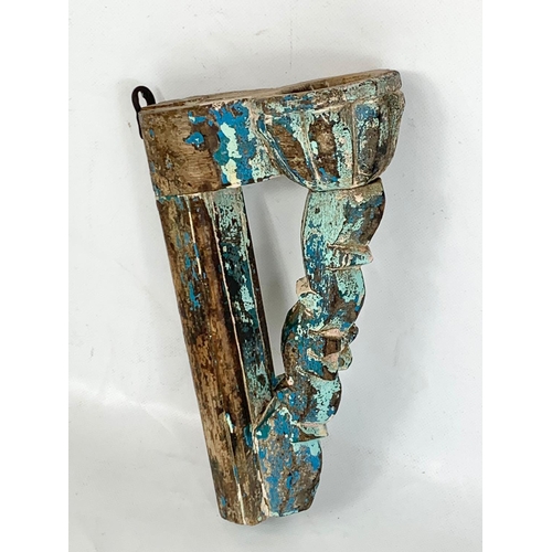 46 - A 19th century carved wall sconce from India with original paint, 14cm x 94cm