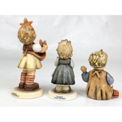 464 - Three M.J. Hummel Goebel pottery figures, 