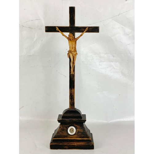 48 - An early 20th century carved wooden crucifix, 20cm x 65cm