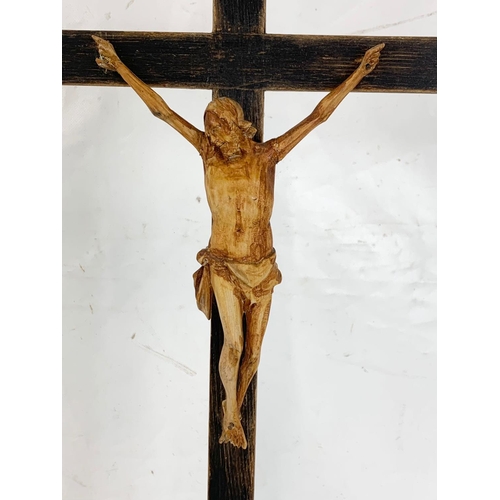 48 - An early 20th century carved wooden crucifix, 20cm x 65cm