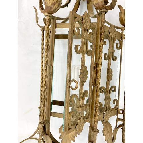 53 - A large early 20th century ornate porch lamp in the Neo Gothic style with matching wall light fixtur... 