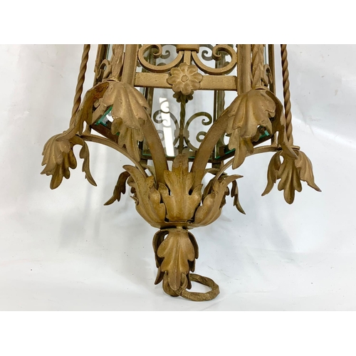 53 - A large early 20th century ornate porch lamp in the Neo Gothic style with matching wall light fixtur... 