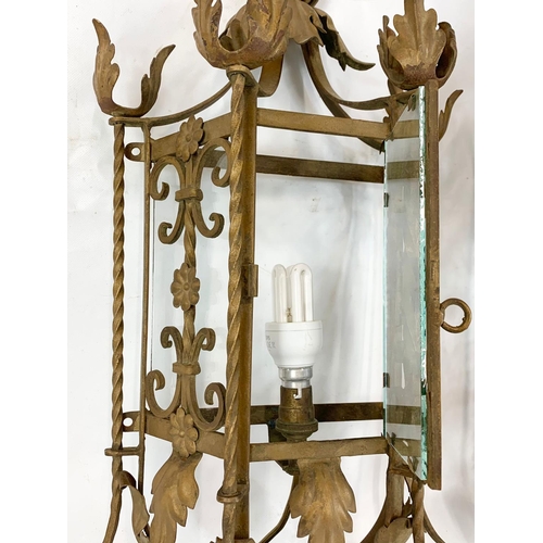 53 - A large early 20th century ornate porch lamp in the Neo Gothic style with matching wall light fixtur... 