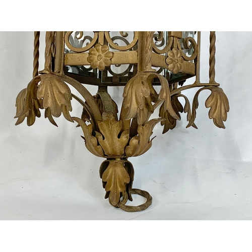 53 - A large early 20th century ornate porch lamp in the Neo Gothic style with matching wall light fixtur... 