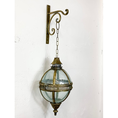 62 - An ornate brass light fixture, 43cm