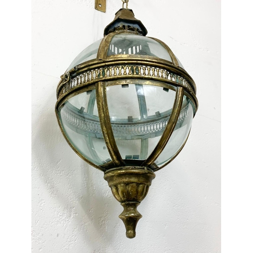 62 - An ornate brass light fixture, 43cm