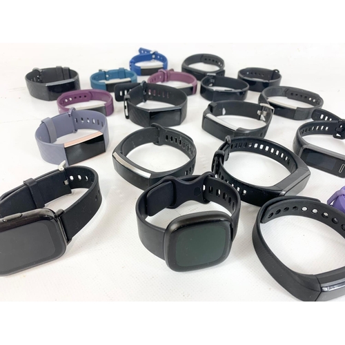 686 - A quantity of Fitbit watches.