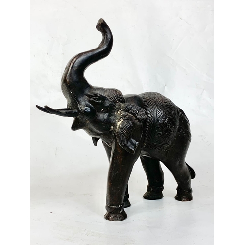 70 - A pair of large late 19th century Burmese bronze  elephants, 32cm x 31cm