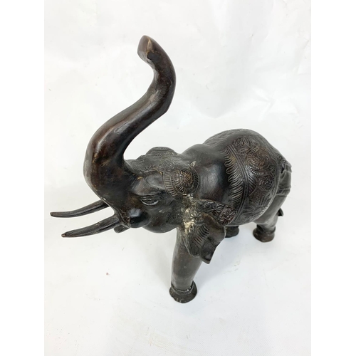 70 - A pair of large late 19th century Burmese bronze  elephants, 32cm x 31cm