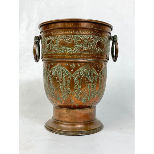 75 - An early 20th century Middle Eastern copper jardinière, 23cm x 27.5cm