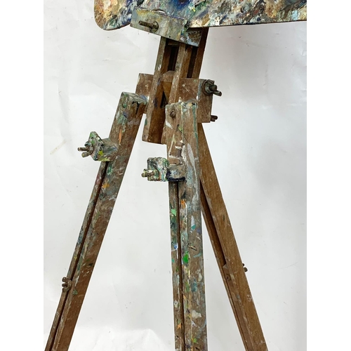 76 - A 1950s easel with paint box, 134cm