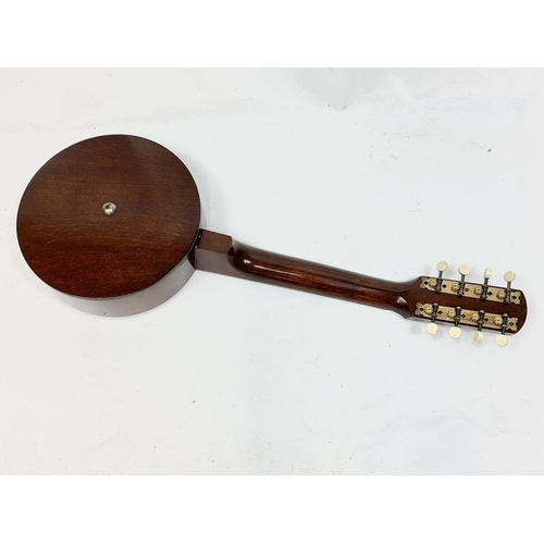 78 - A vintage banjolele in case