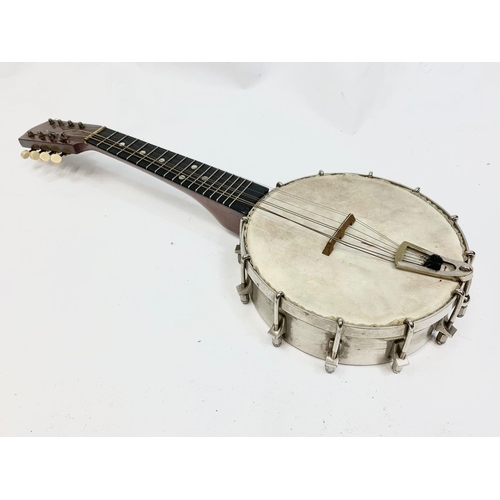 79 - A vintage banjolele in case