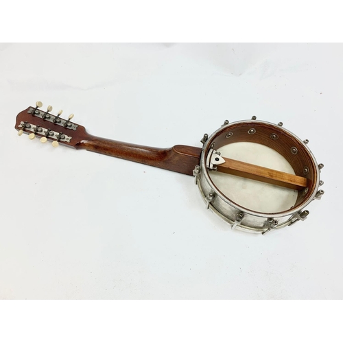 79 - A vintage banjolele in case