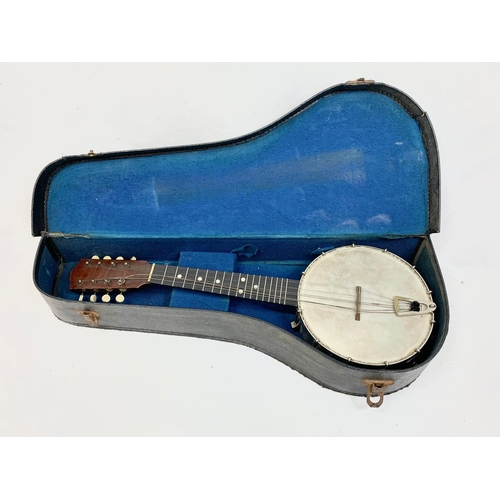 79 - A vintage banjolele in case