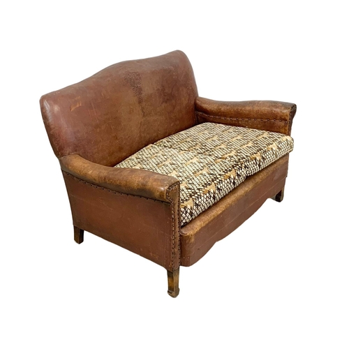 797 - Early 20th Century leather club sofa with original leather, circa 1930. 124x80x80cm