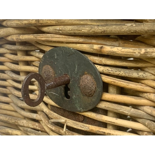 80 - A large Edwardian wicker basket with lock and key, 75cm x 54cm x 52cm