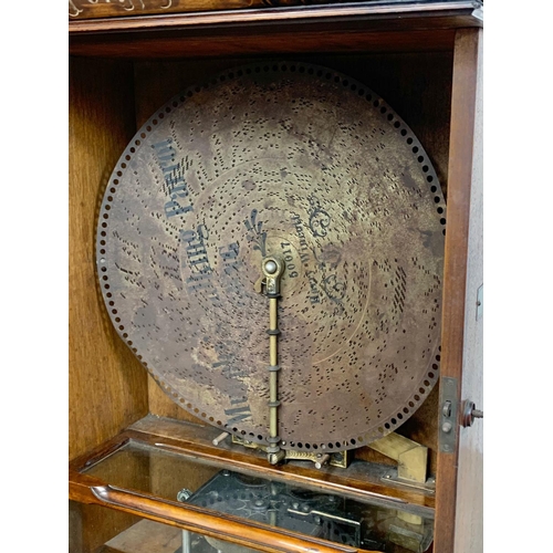 803 - A large 19th century Penny in the Slot polyphon with approx. 65 discs. 70cm x 40cm x 125cm