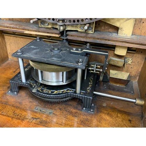 803 - A large 19th century Penny in the Slot polyphon with approx. 65 discs. 70cm x 40cm x 125cm